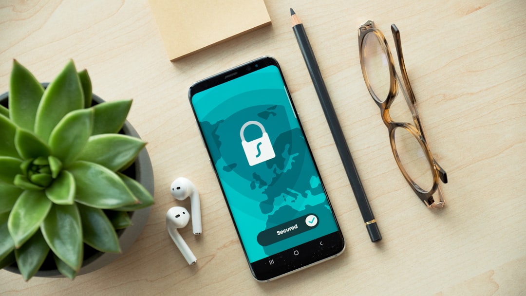 Smartphones and eyeglasses on a desk, representing on-device privacy considerations — Photo by Dan Nelson on Unsplash. Source: https://unsplash.com/photos/black-iphone-5-beside-brown-framed-eyeglasses-and-black-iphone-5-c-ah-HeguOe9k