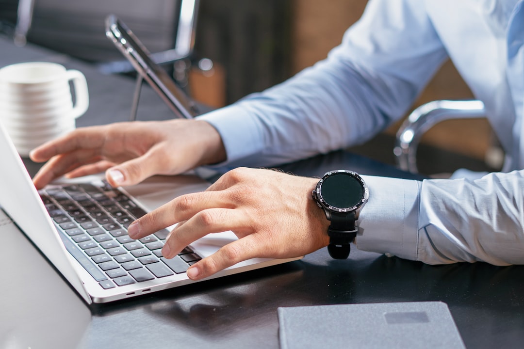 A person reviewing work on a laptop at a desk — Photo by Mina Rad on Unsplash. Source: https://unsplash.com/photos/a-person-typing-on-a-laptop-at-a-desk-jdS1UfbbIA8